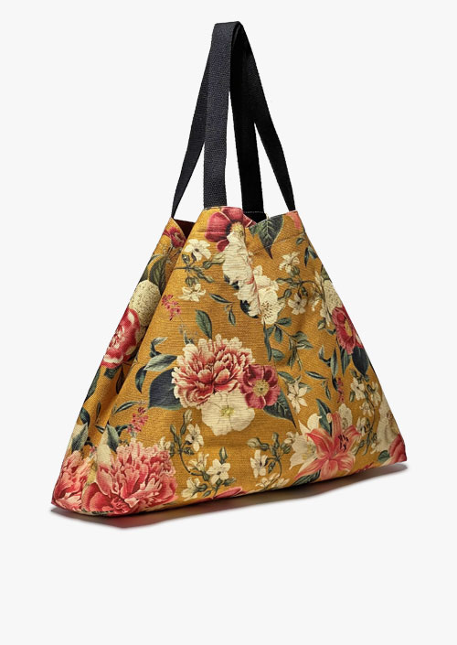 Large-format bag with a vintage flower design on an ocher background